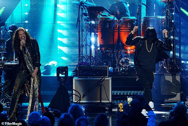 Walk this way: Aerosmith frontman Steven Tyler showed off his rock 'n' roll credentials when he joined Eminem on the hall of fame stage