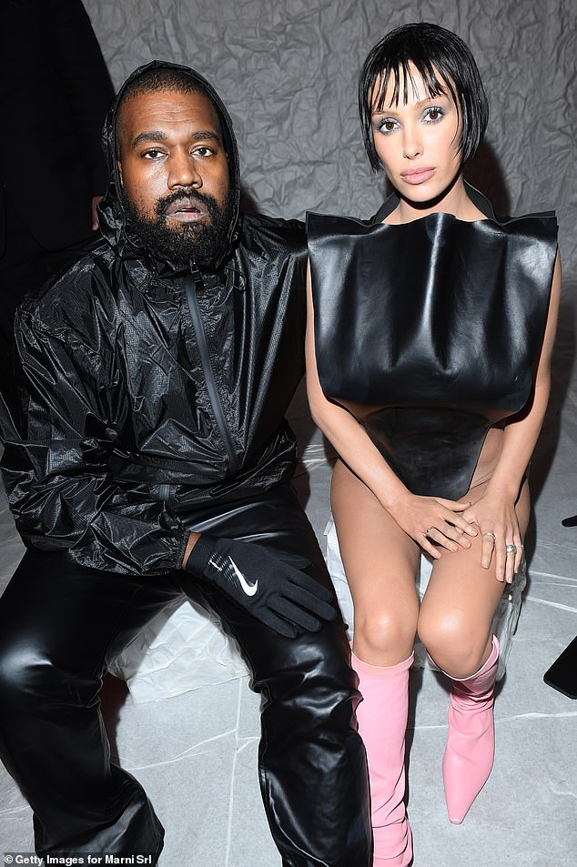 Kanye West shows love for Nike by wearing brand's gloves and shoes alongside wife Bianca Censori at Milan Fashion Week... amid feud with Adidas | Daily Mail Online