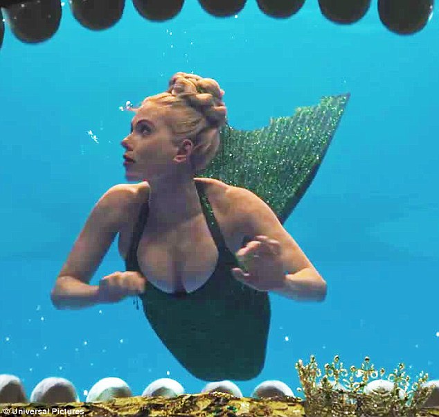 Flipping her fins: The blonde beauty looked elegant as she could be seen filming underwater in one quick scene of the action-packed trailer