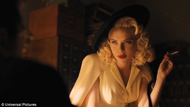 Vintage vixen: Scarlett later showed off dreamy, blonde curls as she donned a fitted, white button down top