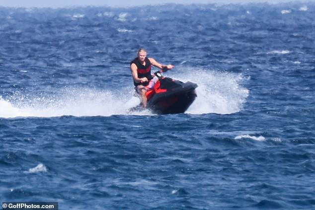 The Man City star was later seen riding a jet ski as he made the most of his time off this summer