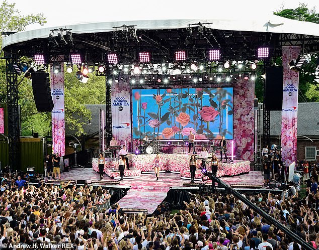 Stunning! The stage was ultra femme with a massive flower wall, a floral printed floor and screen that buzzed to live with flowers and words from her songs