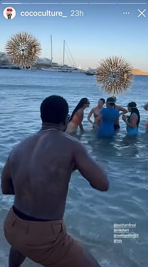 Kevin kept the party going on the beach as he danced with his feet in the water while joined by his friends