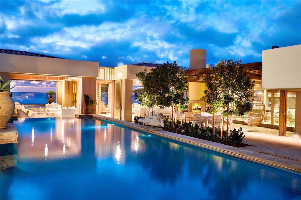 The estates features a glass-tiled pool, a 10-person jacuzzi and a tennis court