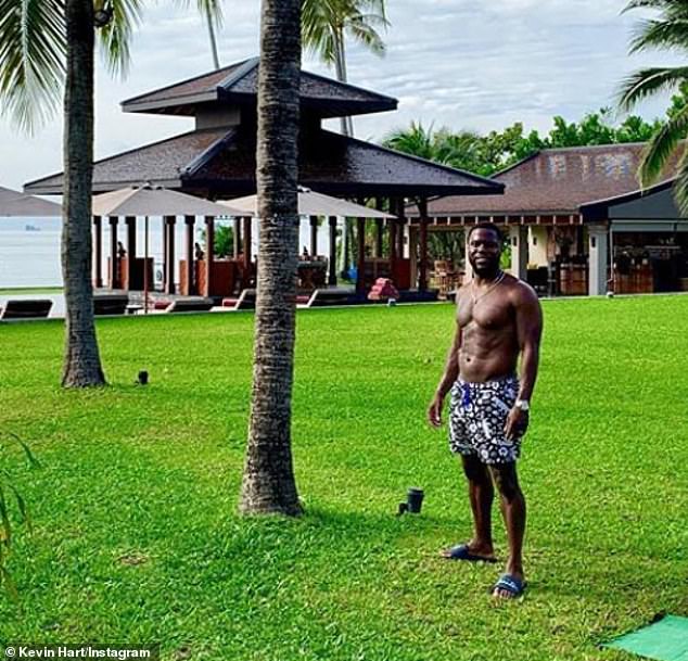 Hot hart: Kevin Hart is currently enjoying a vacation in Thailand as seen on his Instagram, in a picture posted Monday he poses shirtless near palm trees