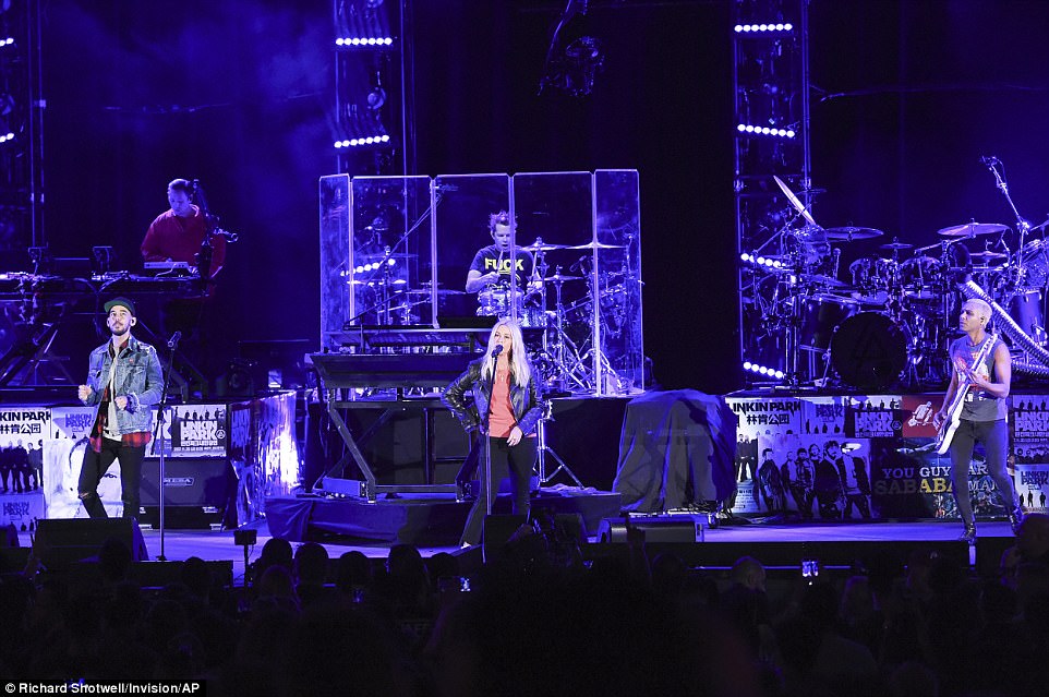 Alanis Morissette (center) performs with Shinoda (left) and Tony Kanal (right), the bassist for No Doubt