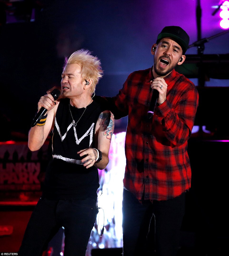 Shinoda is pictured performing with Deryck Whibley of Sum 41 at the tribute concert to Bennington. 'I don't have the words,' Shinoda told the crowd. 'I don't think any of us do'