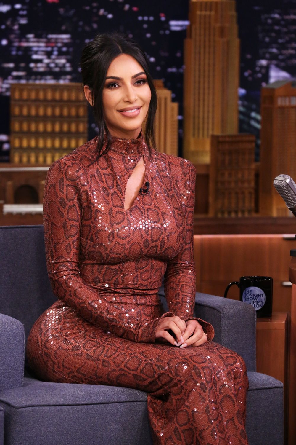 Kim Kardashian's snakeskin dress is so tight it must be constricting her  internal organs