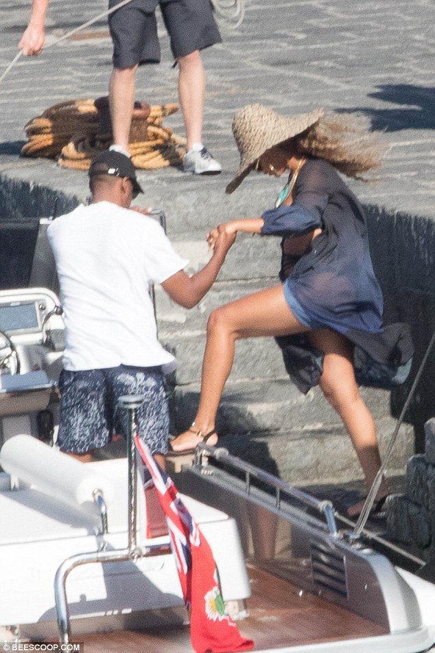 Leggy: The music superstar showed off her long legs as she climbed aboard