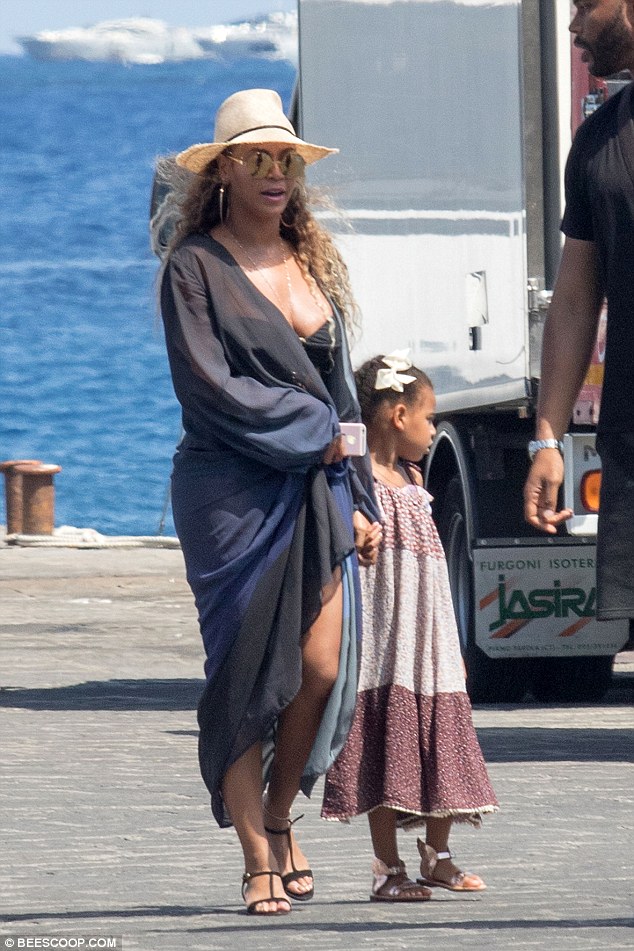 Mini-me: Little Blue Ivy was also in tow, looking cute in a burgundy summer dress